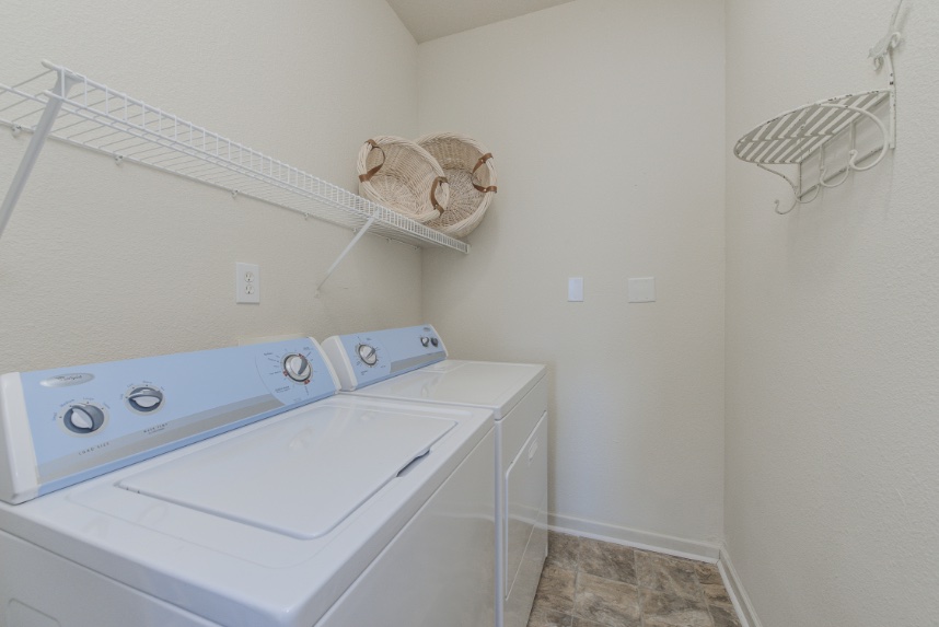 Laundry room with storage space in Fishers.